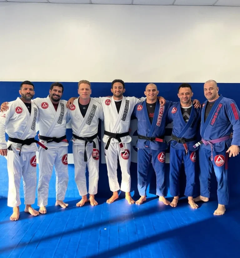 Gracie Barra black belts together on the mats